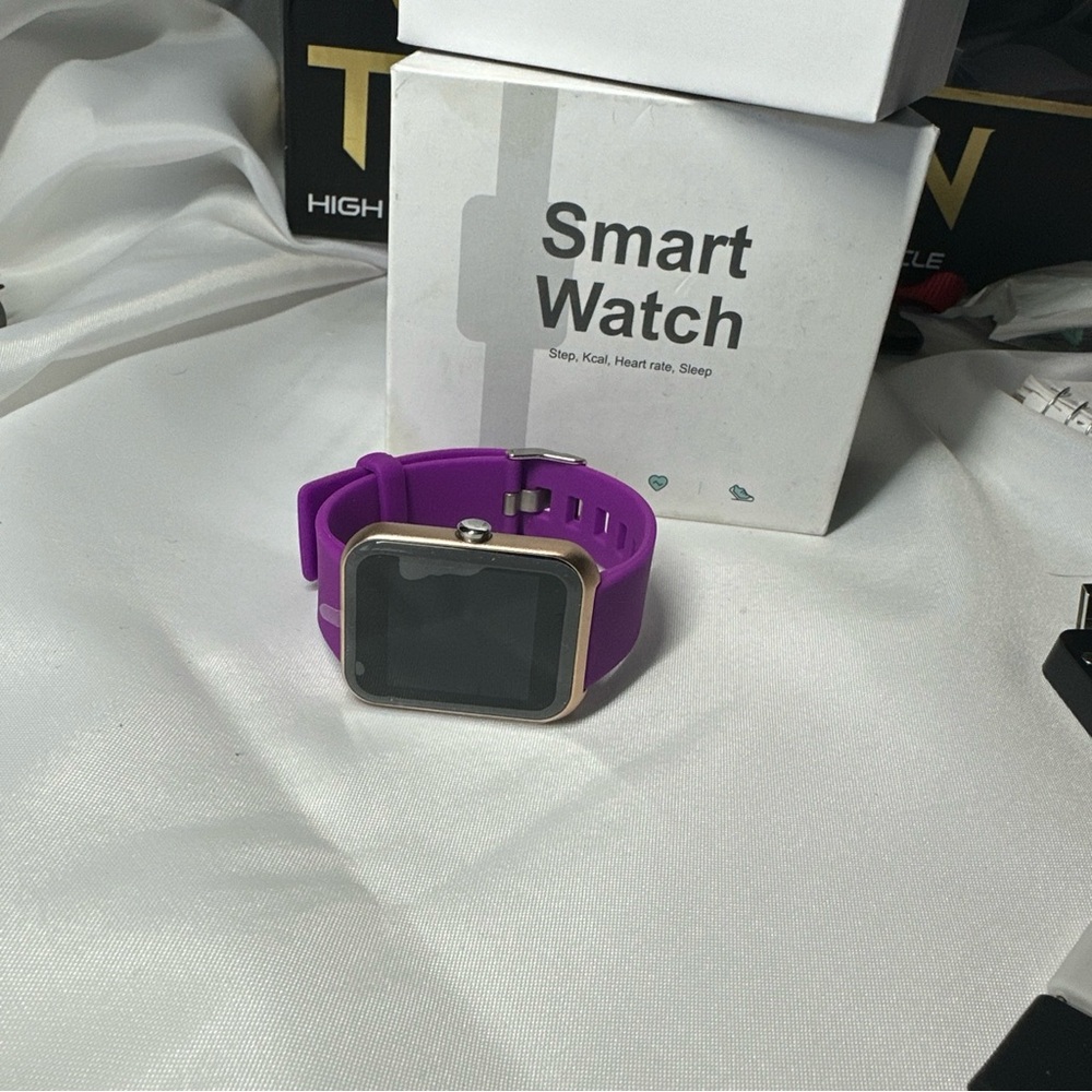 Smart watch NEW in box. Changeable bands included in pink black blue white